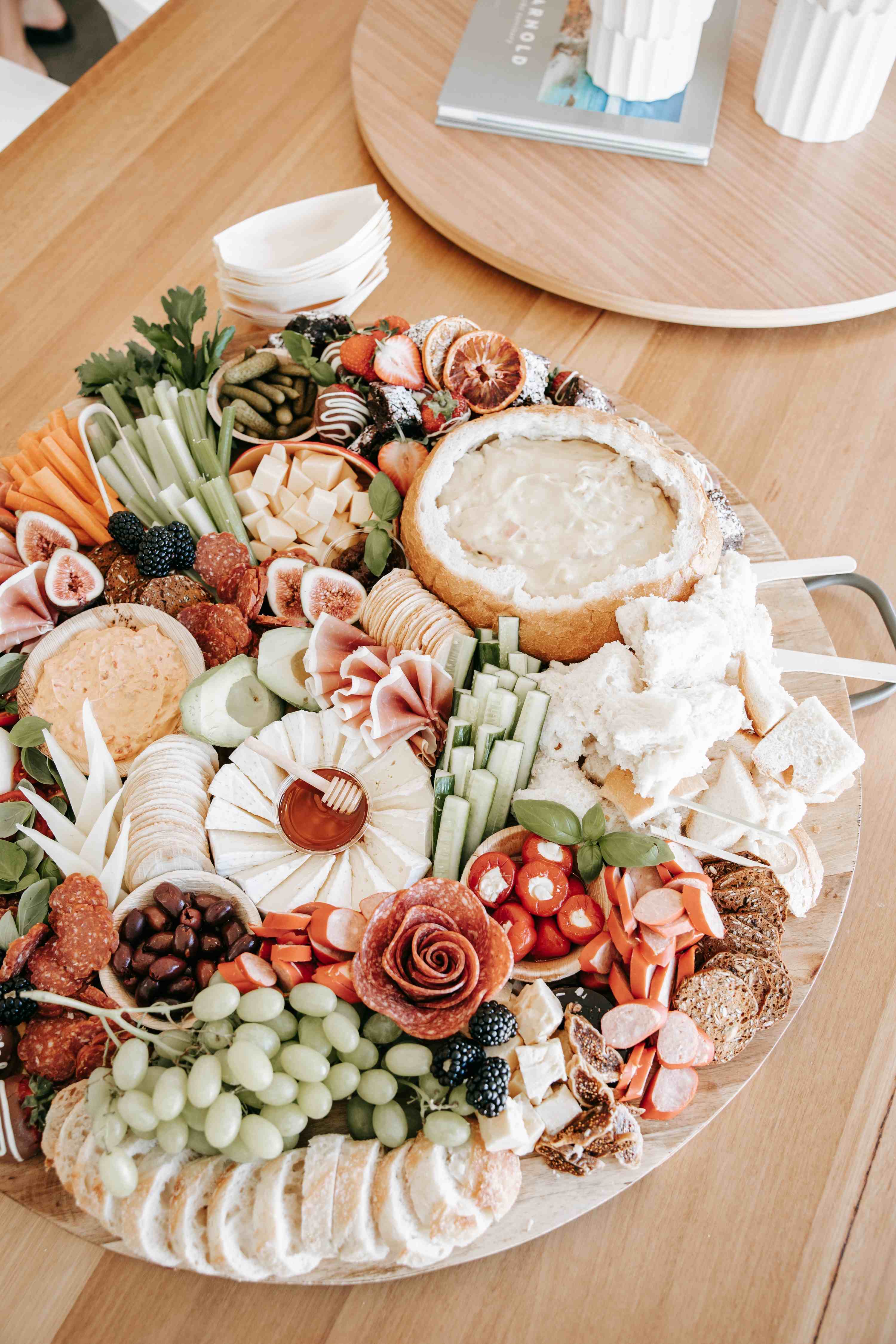 Round grazing platter with cob loaf dip and fresh produce